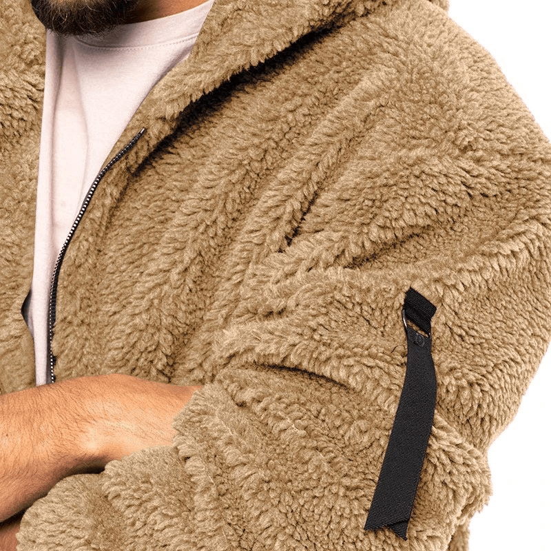 Close-up of a man's arm wearing a casual fleece zip-up hooded jacket SF1897, with cozy fur texture and black zipper detail.