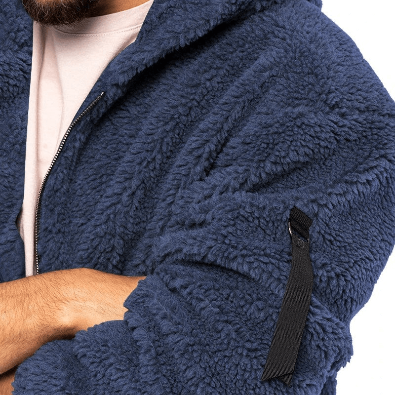 Cozy navy blue fleece zip-up hooded jacket for men with unique arm pocket, perfect for casual outdoor style.