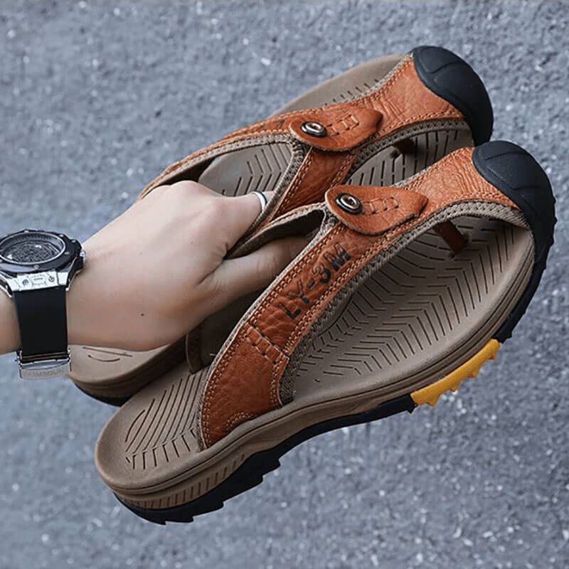 Casual men's genuine leather anti-slip flip flops SF1068, showcasing durable brown leather and rubber sole for outdoor wear.