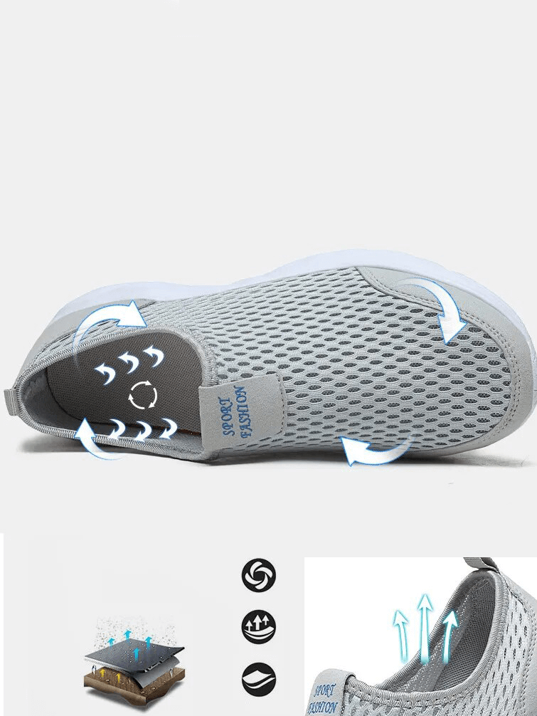 Gray mesh sneakers with breathable design, showcasing anti-slip soles and lightweight material for casual comfort.