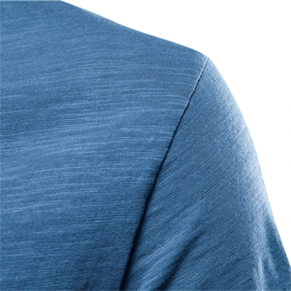 Close-up of blue solid color crew neck t-shirt showcasing fabric texture and stylish casual design for men.