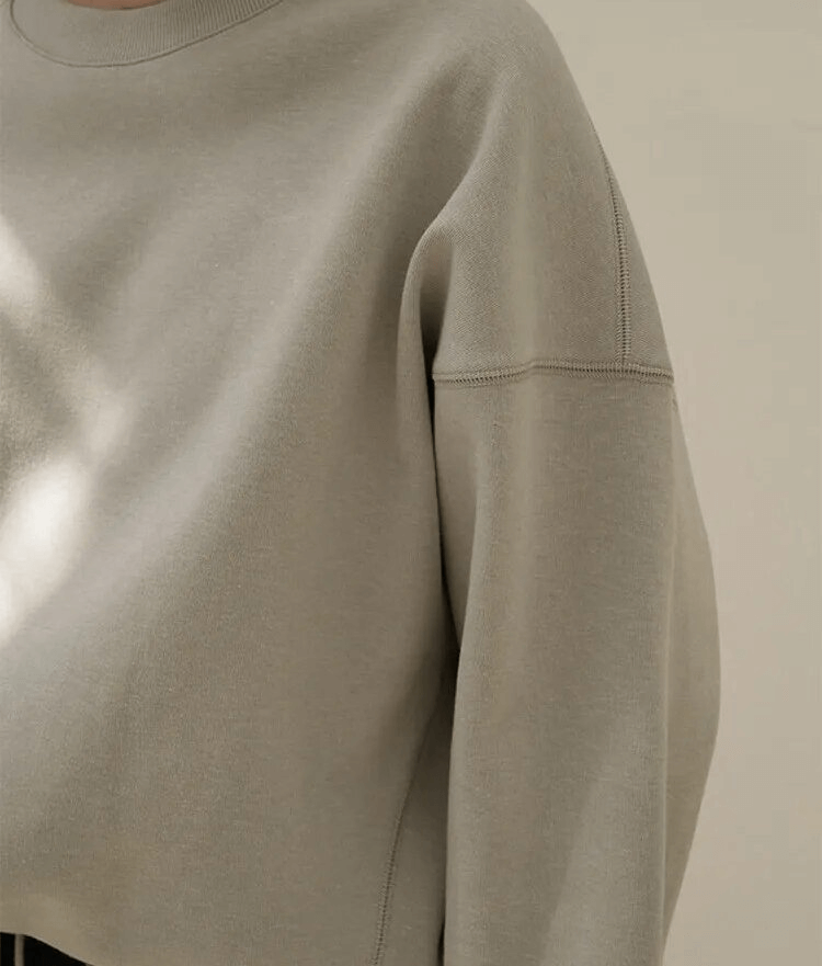 Casual solid women's hoodie with O-neck and loose fit, made of breathable 100% cotton, showing drawstring detail for style and comfort.