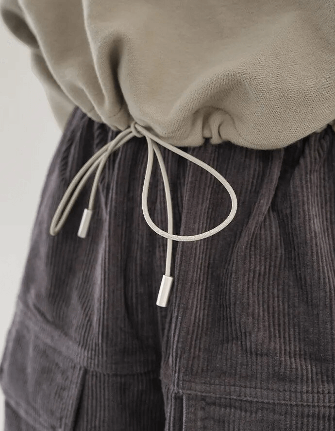 Close-up of casual solid women's hoodie with O-neck and drawstring for a snug fit, perfect for style and comfort.