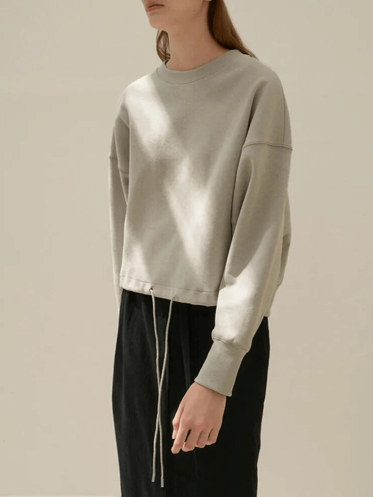 Casual solid women's hoodie with O-Neck, 100% cotton, featuring drawstring detail, shown in a stylish and comfortable fit.