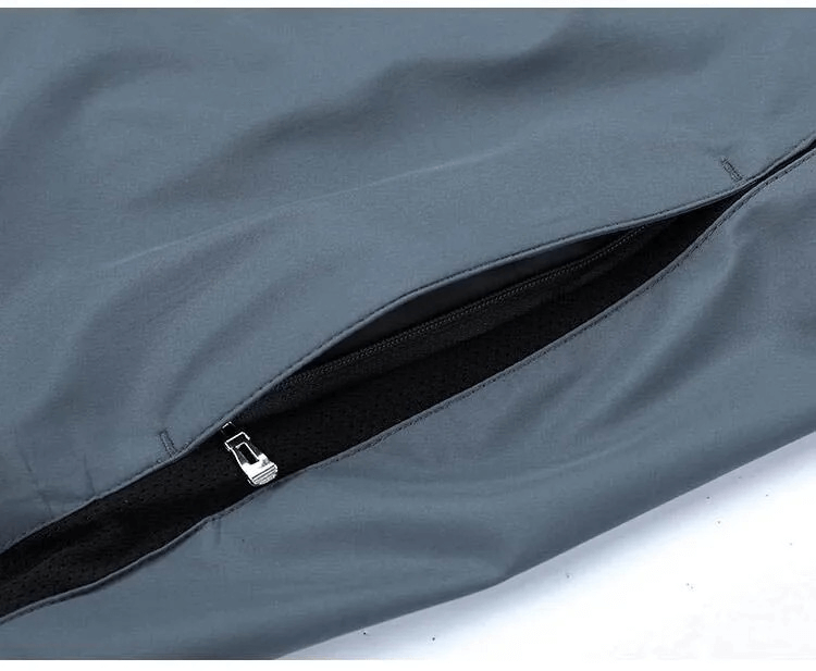 Close-up view of the zippered closure on a men's casual track jacket in polyester fabric, part of the SF2034 sportswear set.