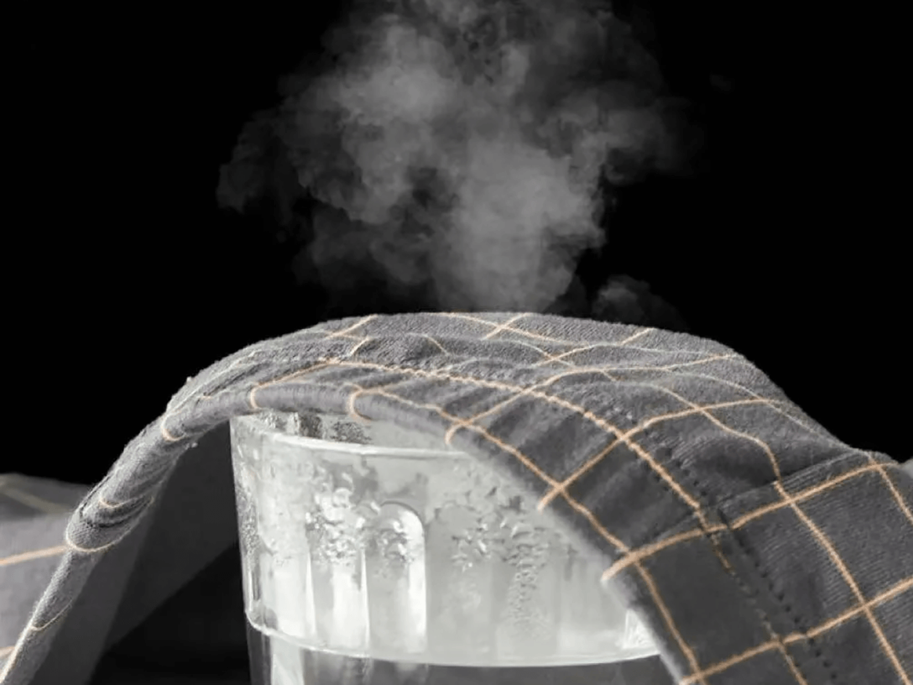Checked Male Boxers with Everyday Stretch Fit - SF4673 resting atop a glass of steaming water