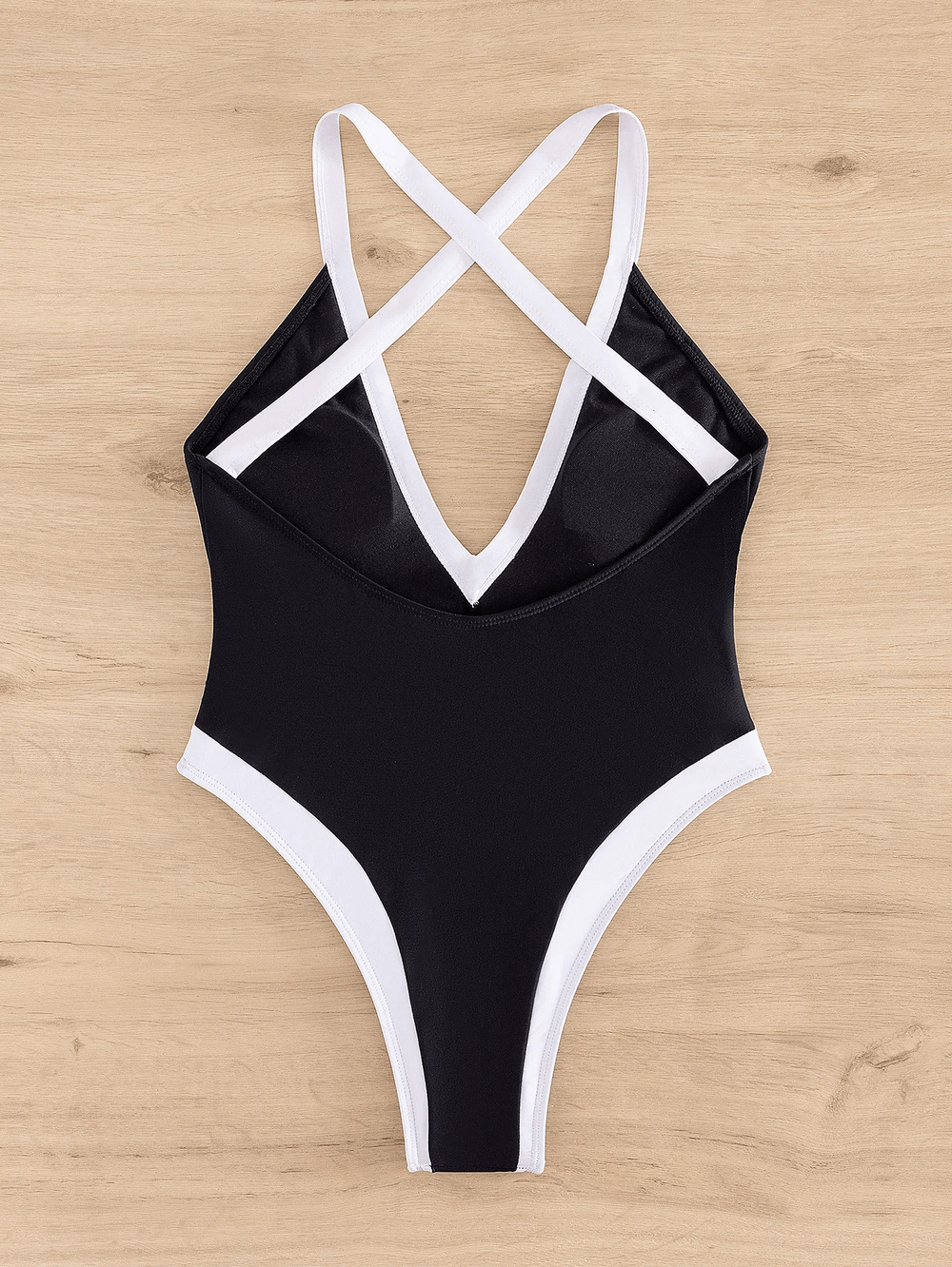 Chic black and white one-piece swimsuit with crisscross neckline and flattering cutouts, SF2149, perfect for poolside elegance.
