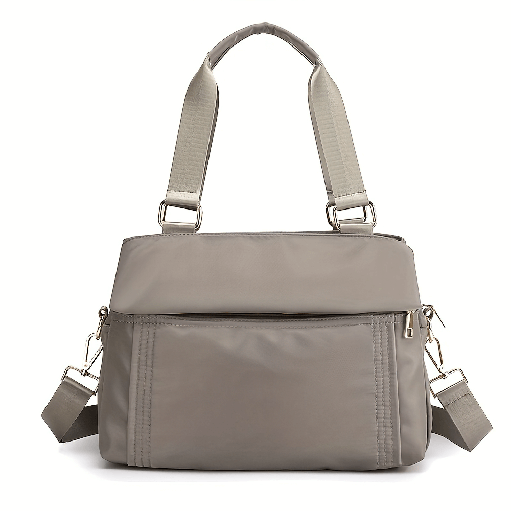 Chic SF2666 multi-pocket nylon tote bag with removable strap, showcasing large capacity and stylish design. Perfect for travel and daily use.