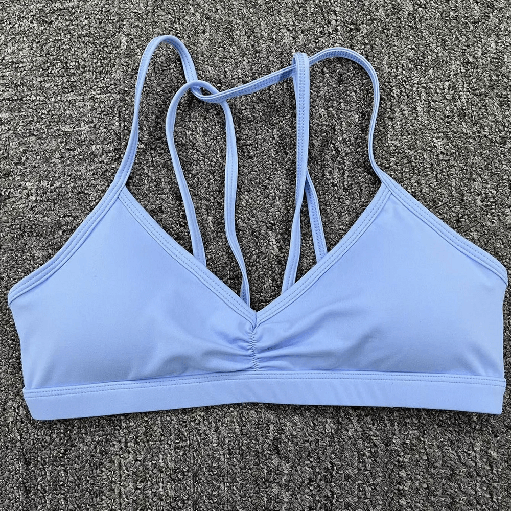 Chic Multi-Strap Sports Bra with Strappy Back Design in Light Blue for Active Wear