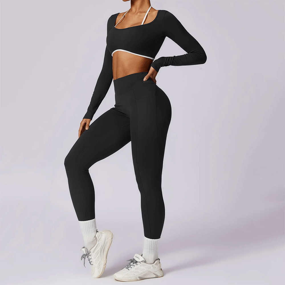 Stylish black nylon yoga set with a long-sleeved crop top and high-waist leggings for women, perfect for fitness and outdoor activities.
