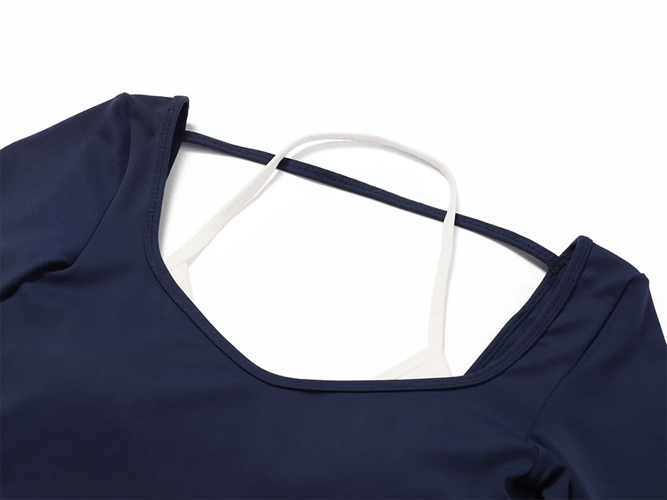 Close-up of navy long-sleeved crop top from women's nylon yoga set, showcasing sleek design and breathable fabric for fitness.