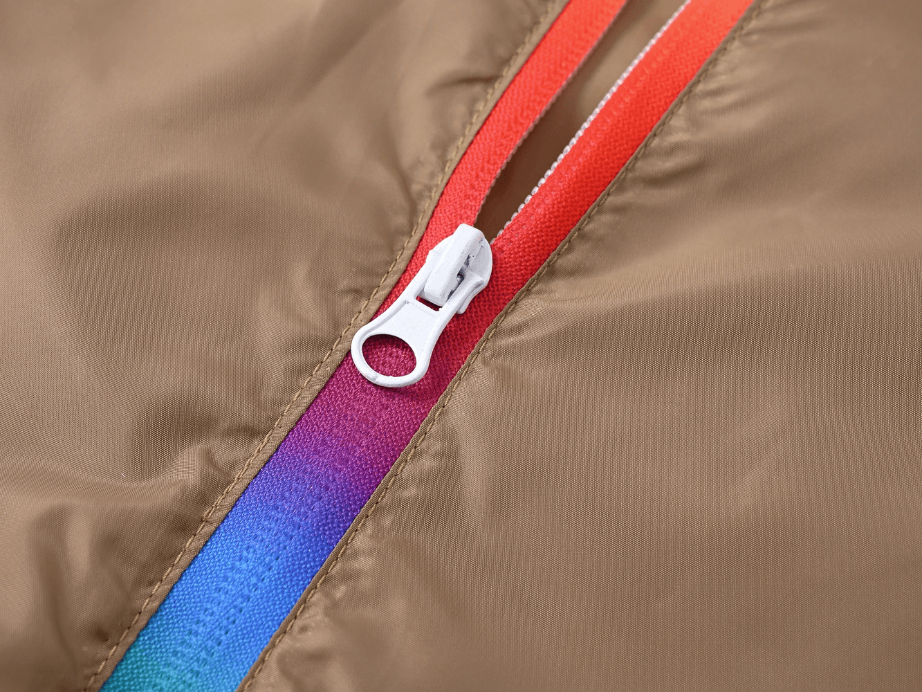 Close-up of the rainbow zipper detail on the Children's Rainbow Zipper Hooded Jacket - SF3639, showcasing the vibrant color gradient.