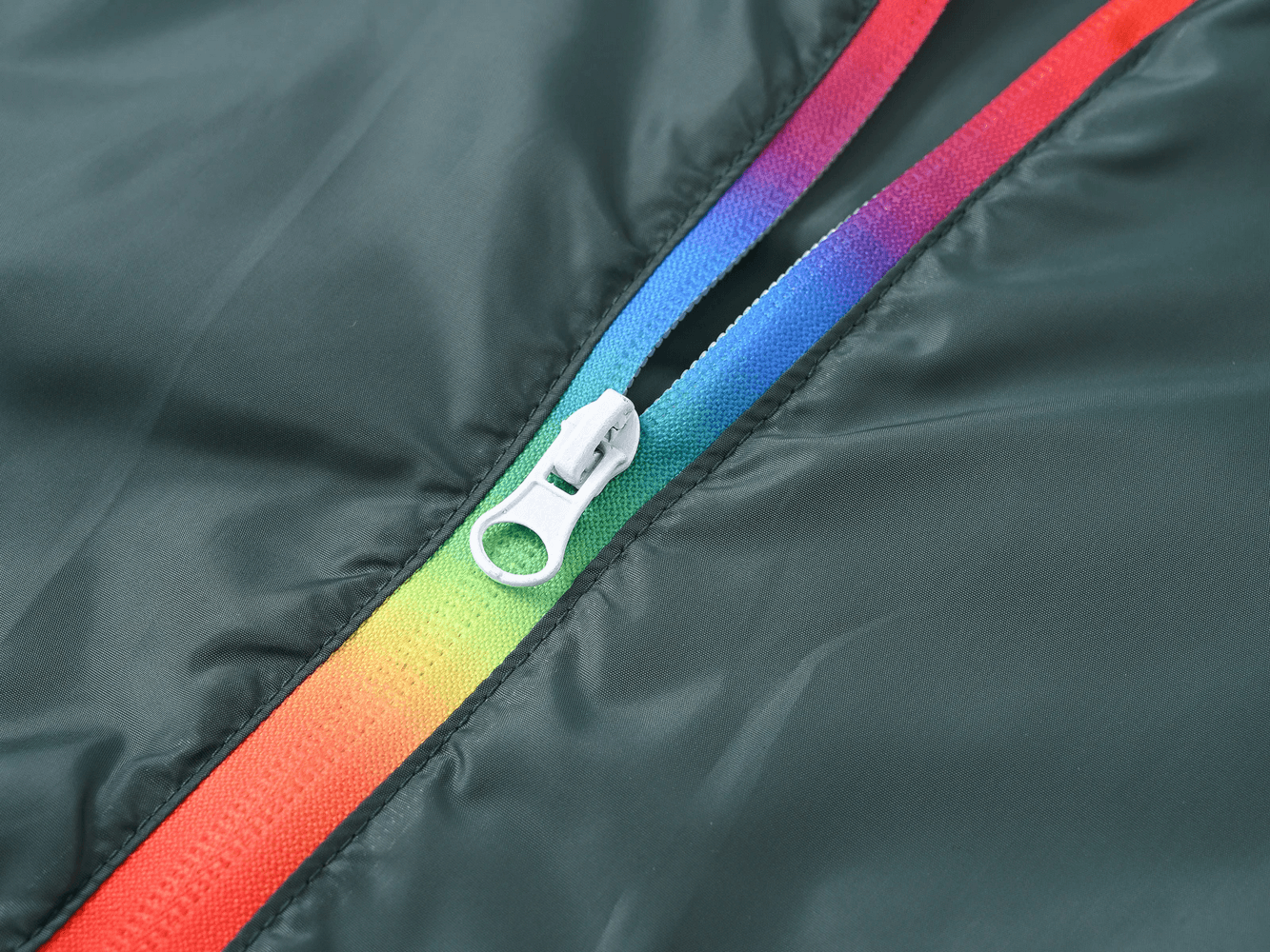 Close-up of the rainbow zipper on the Children's Rainbow Zipper Hooded Jacket - SF3639, highlighting the colorful trim and zip detail.