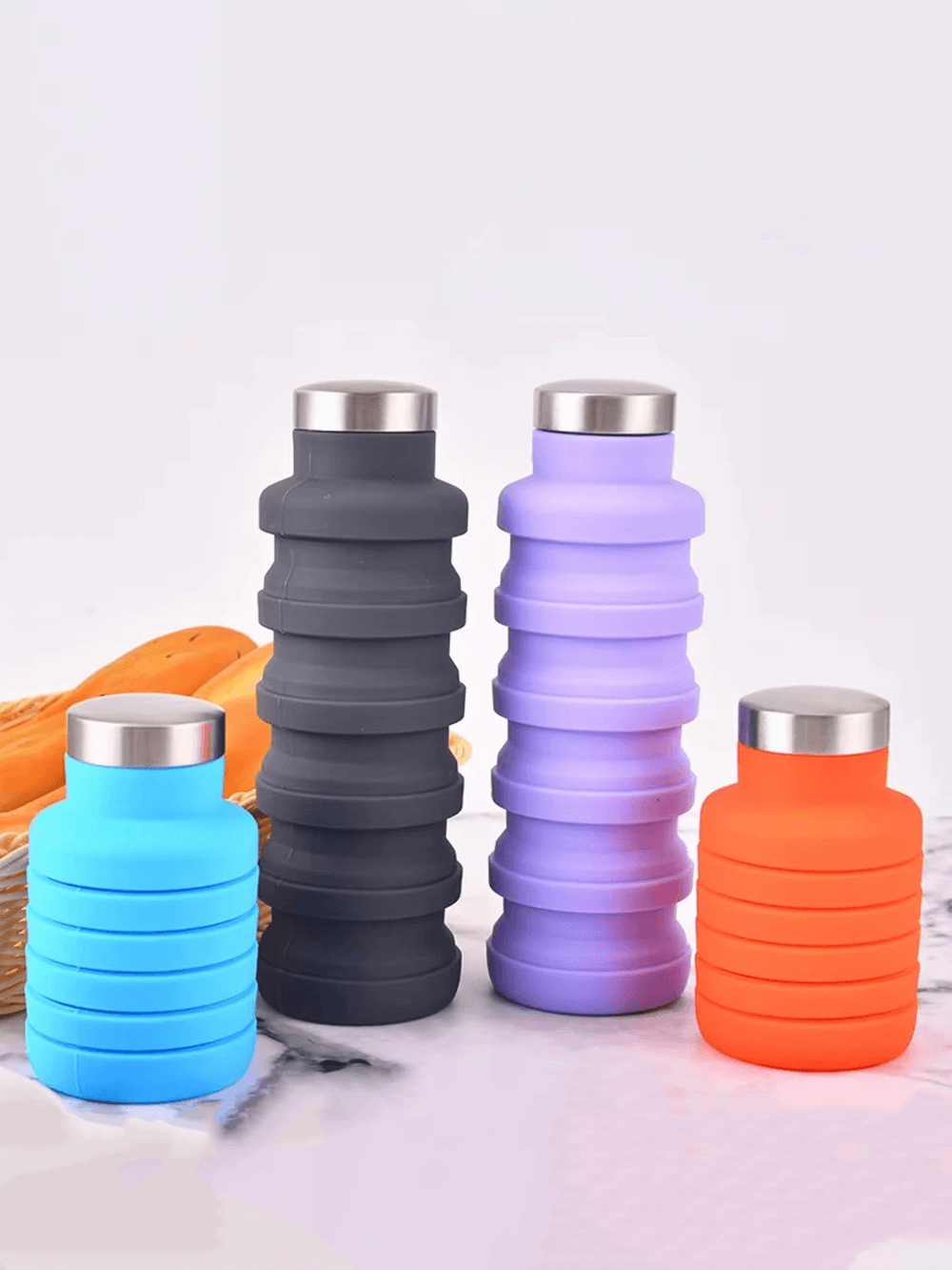 Colorful collapsible silicone water bottles for hiking - SF3485 on display.