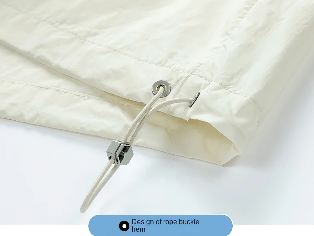 Design detail of the adjustable drawcord hem on the Color Block Hooded Windbreaker Jacket with Pockets - SF4725.