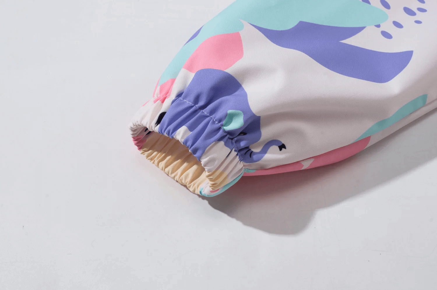 Close-up of sleeve on Kids' Colorful Elephant Print Waterproof Zip Jacket - SF3596, showcasing vibrant design and waterproof fabric.