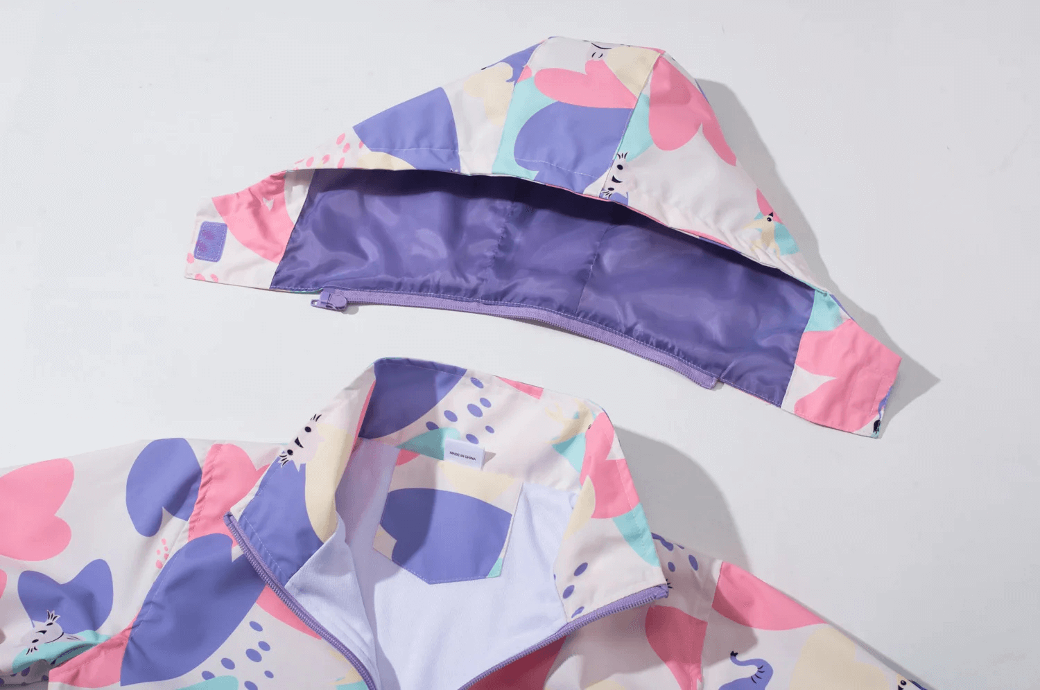 Colorful Elephant Print Waterproof Zip Jacket - SF3596 with detachable hood and vibrant design, perfect for staying dry and stylish.