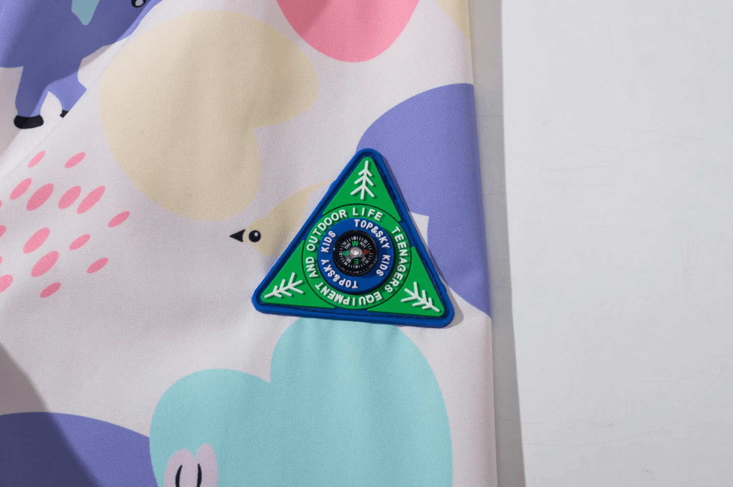 Colorful Elephant Print Waterproof Zip Jacket - SF3596 with vibrant design and outdoor-themed badge.