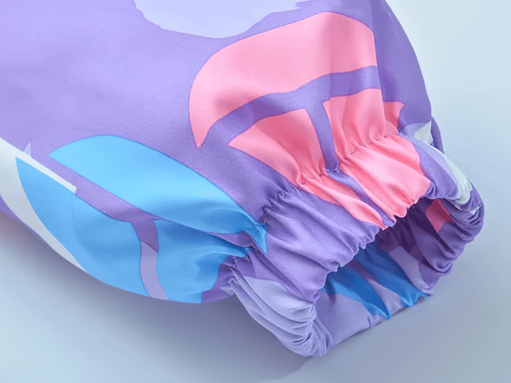 Cuffed sleeve detail of Colorful Windbreaker Jacket with Fleece Lining - SF3579 with geometric pink, blue, and purple design.