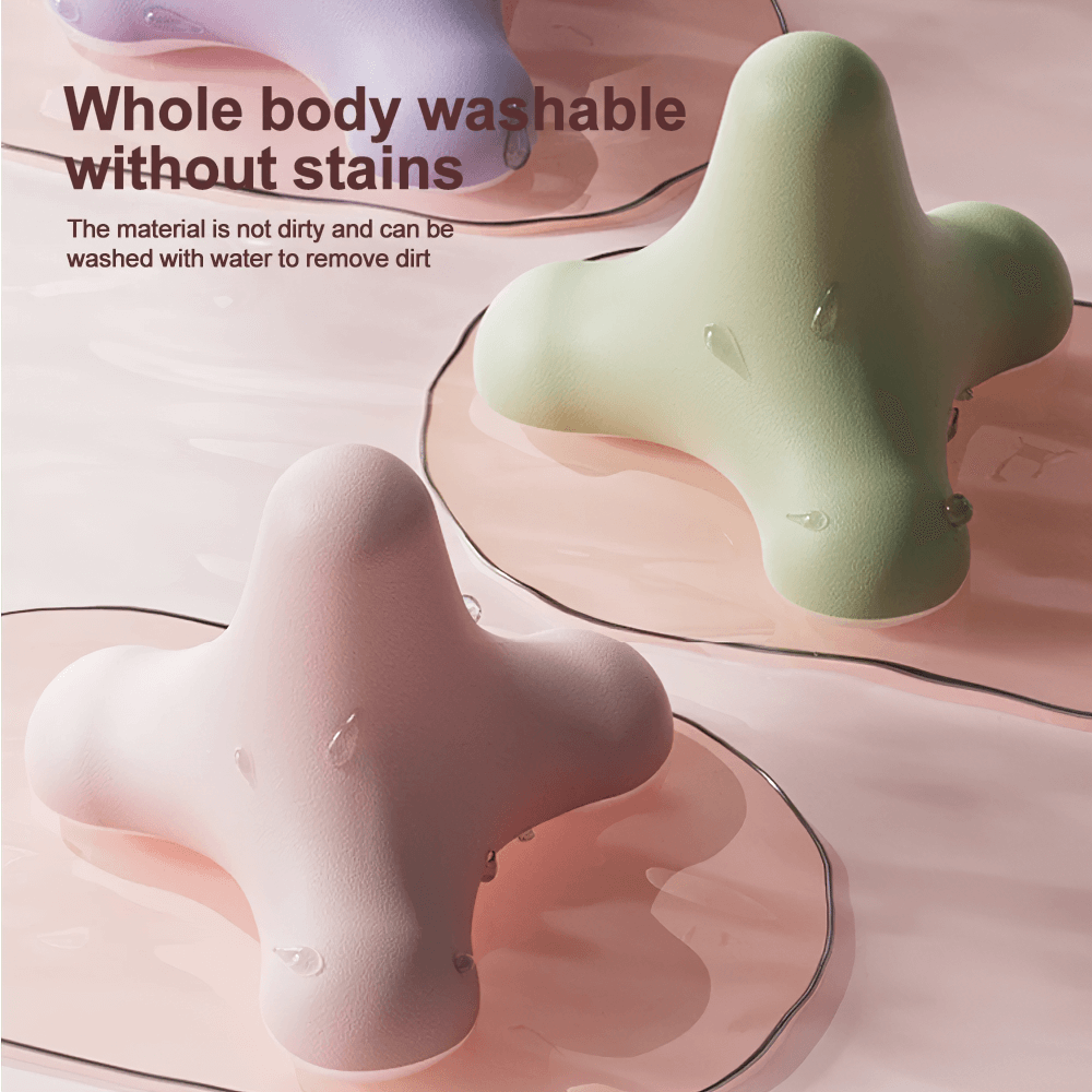 Green and pink compact 3D massage balls, washable and designed for muscle relaxation, shown on a light surface with water droplets.