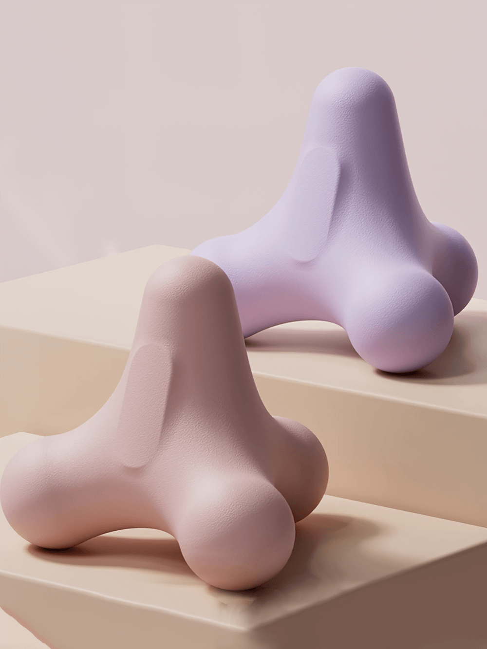 Lavender and beige compact 3D massage balls for muscle relaxation, designed for back, foot, and bicep stress relief.