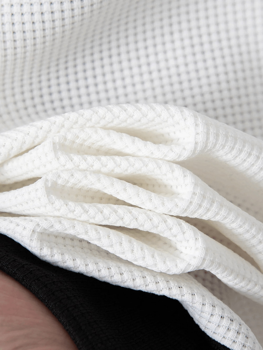 Close-up of the textured fabric of the Contrast Color Stand Collar Jacket with Pockets - SF4643.