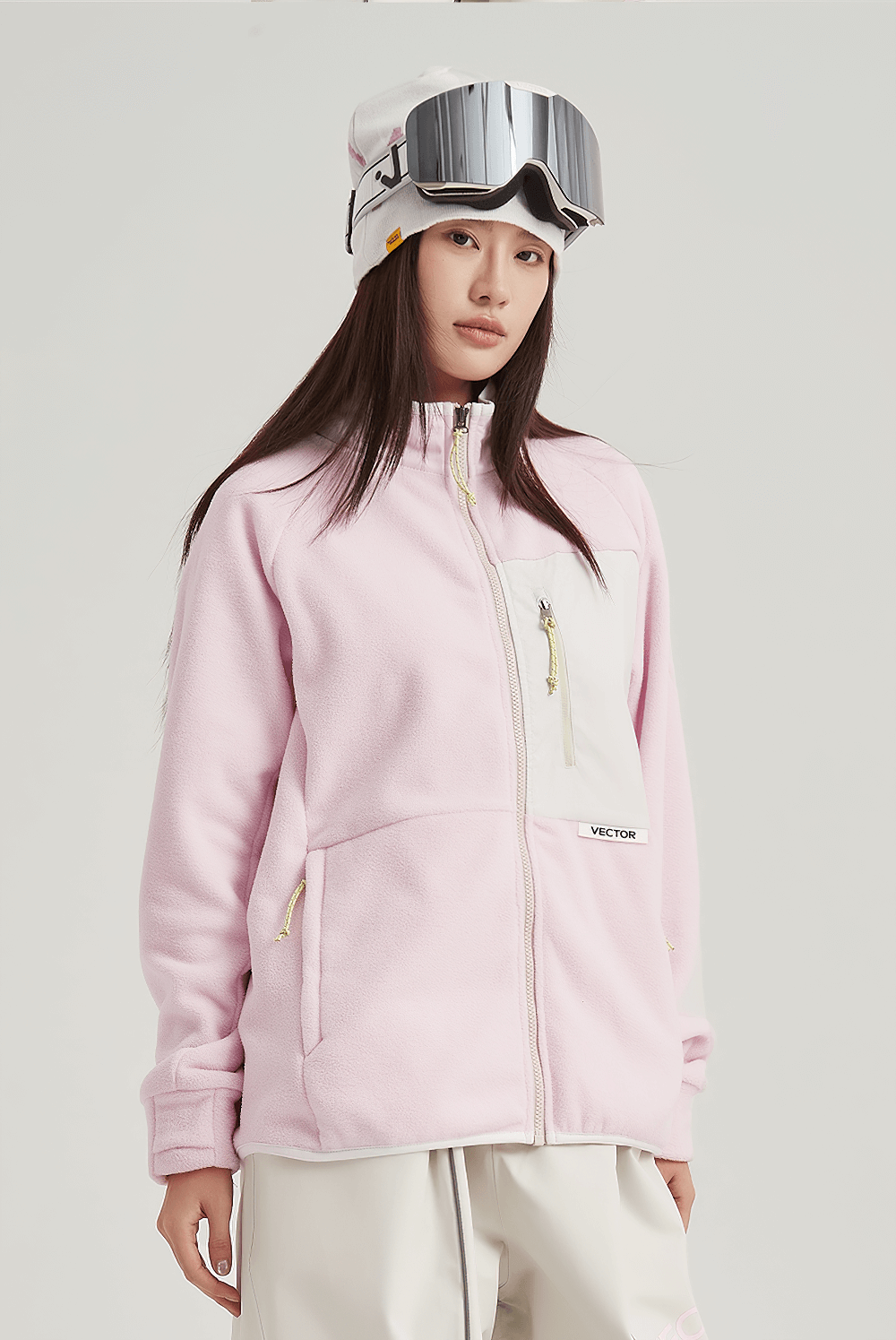 Warm pink contrast full-zip fleece jacket for skiing, featuring a zip pocket and durable polyester, perfect for outdoor activities.