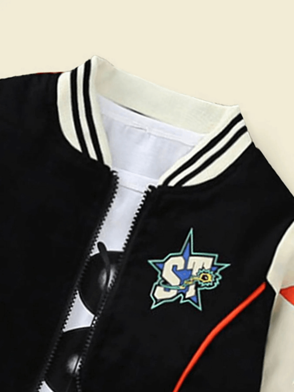 Contrast varsity jacket for kids featuring star print and bold STARTER lettering, perfect for adding a sporty vibe to any outfit.