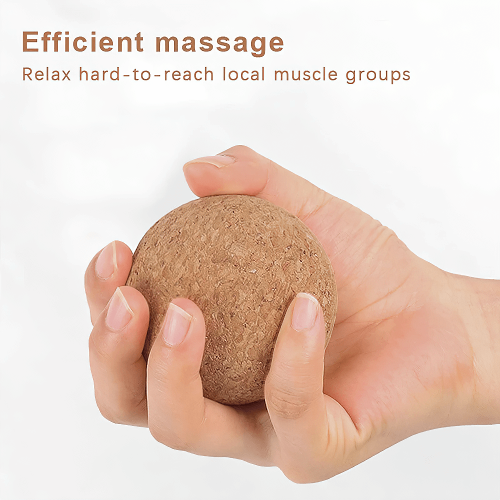 Hand holding a cork massage ball for fascia trigger points, ideal for deep tissue muscle relief and yoga, promoting circulation and relaxation.