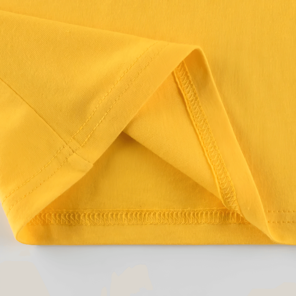 Close-up of bright yellow fabric, highlighting the seamless stitching and soft texture. Perfect for active wear.