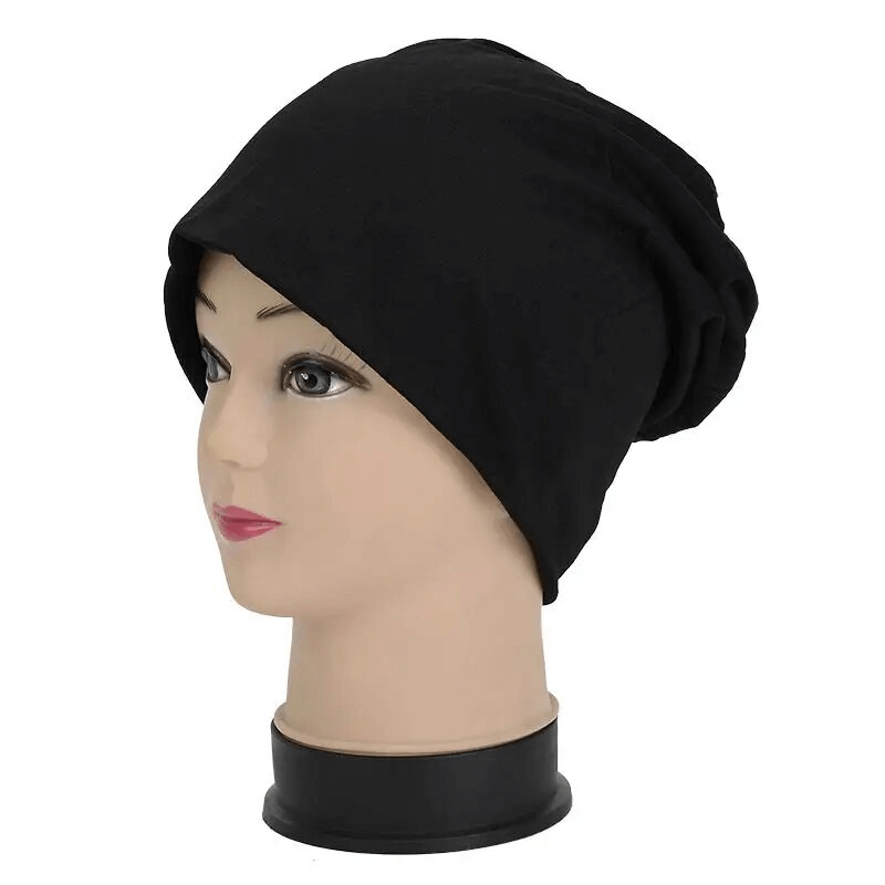 Unisex black cotton lightweight slouchy beanie for running on mannequin, perfect for outdoor activities and keeping warm.