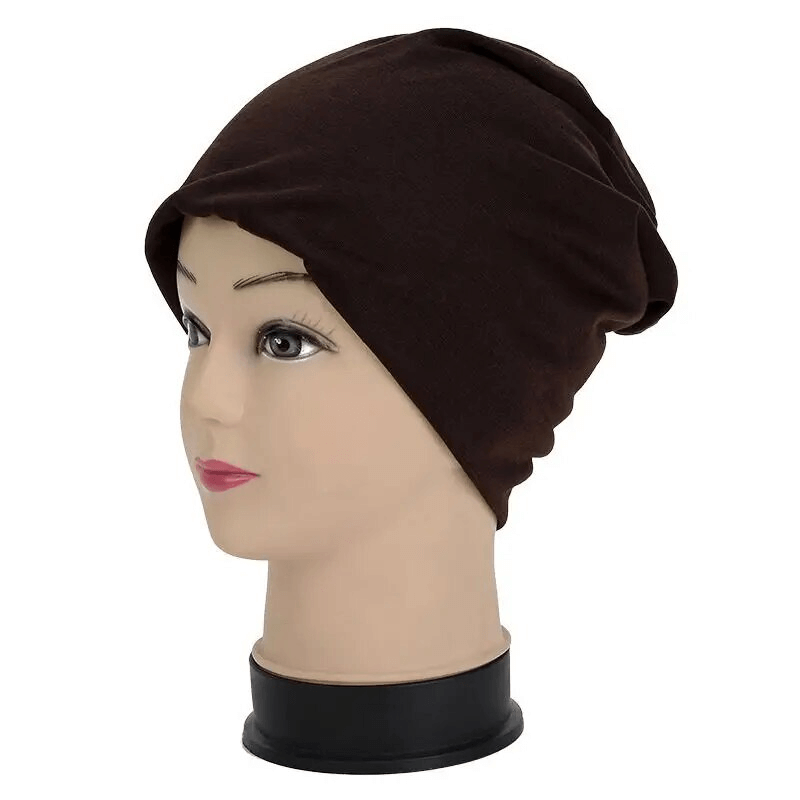Cotton soft lightweight brown slouchy beanie for running displayed on a mannequin, perfect for outdoor activities and casual style.