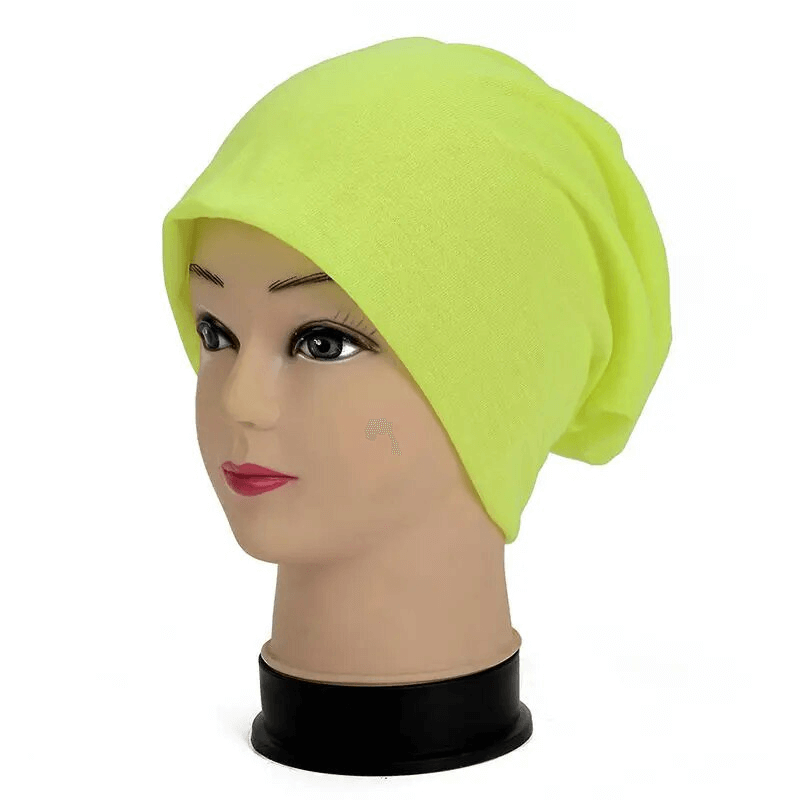 Unisex cotton soft lightweight slouchy beanie in neon yellow for running and outdoor activities, modeled on a mannequin.
