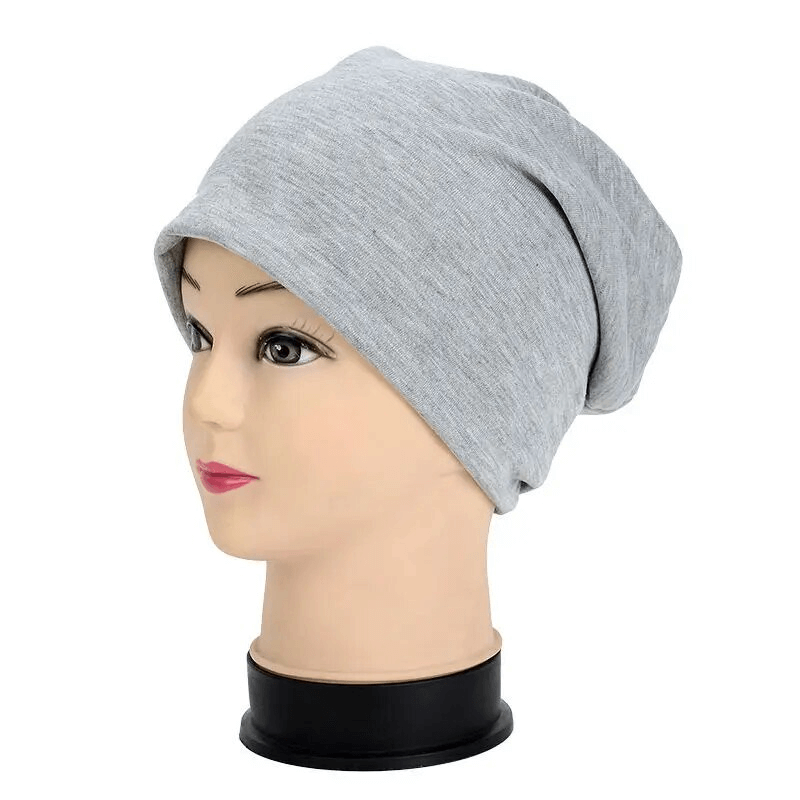 Gray cotton soft lightweight slouchy beanie for running on mannequin head. Unisex, outdoor, casual style, keeps you warm.