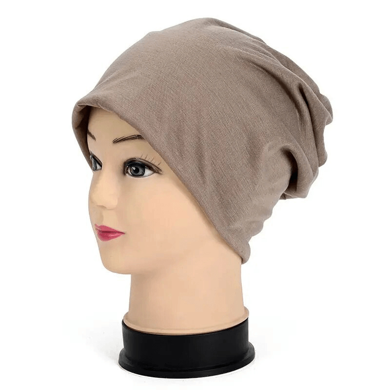 Unisex cotton soft lightweight slouchy beanie in beige on a mannequin head, perfect for running and outdoor activities, style SF1737.