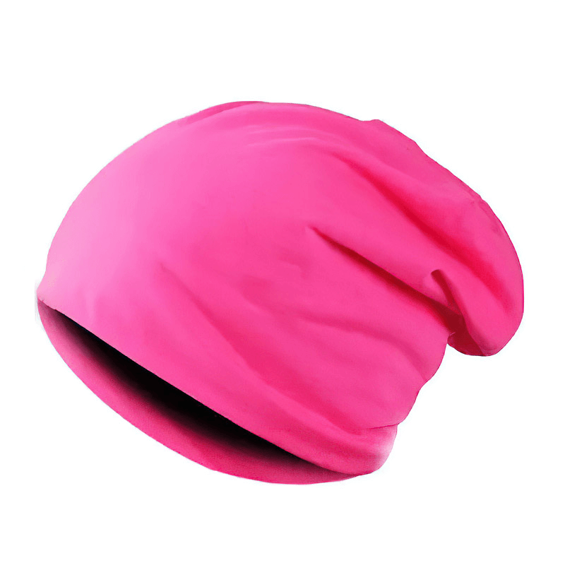 Bright pink cotton slouchy beanie for running, lightweight and unisex, perfect for outdoor activities and keeping warm.