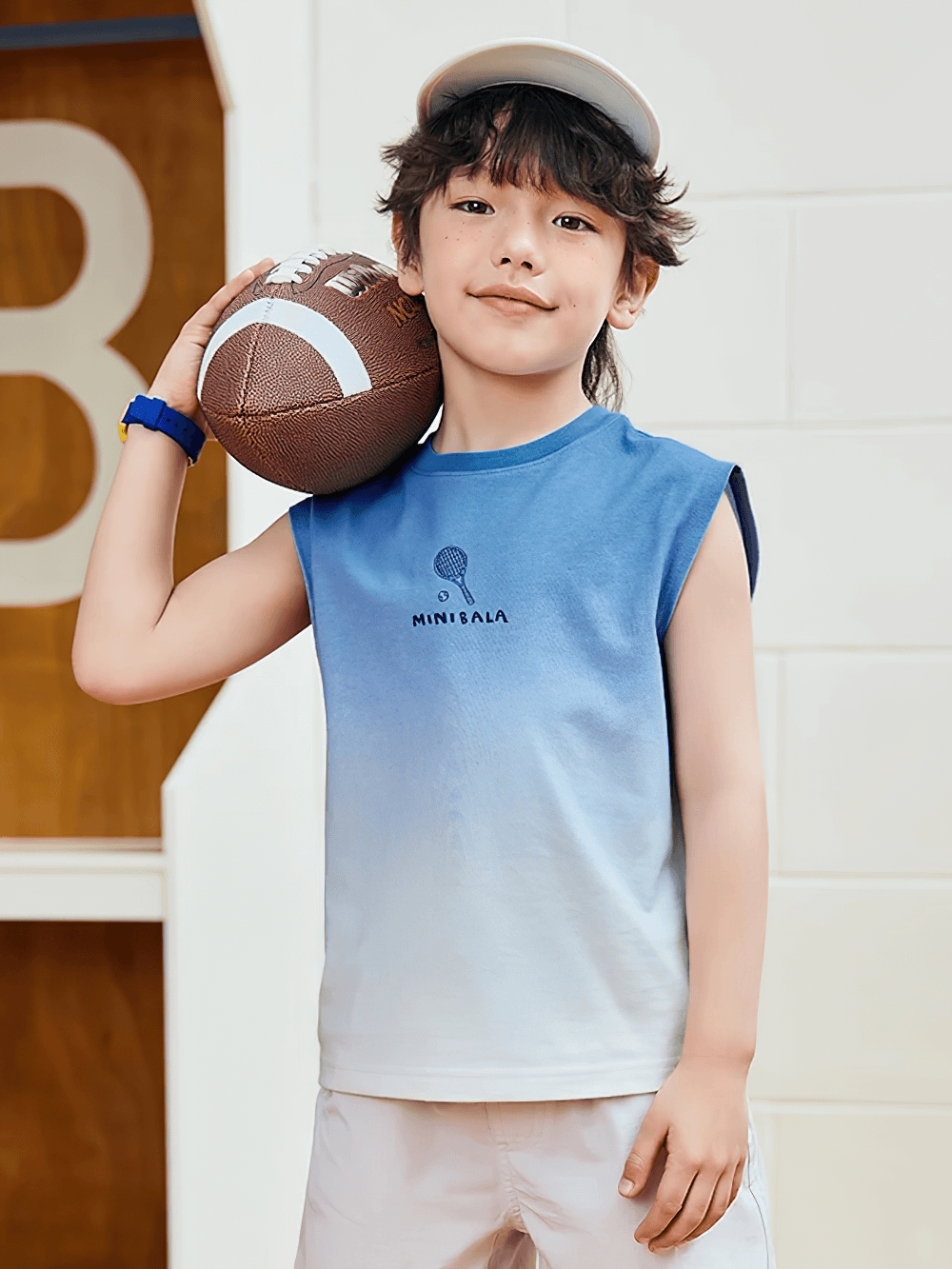 Boy in Cotton Tank Top with Tie-Dye Gradient Design - SF3684 holding a football, perfect for summer activities.
