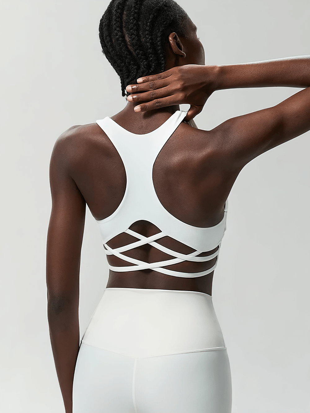 Model wearing Crisscross Back Sports Bra with Removable Pads - SF4040, showcasing stylish design and supportive fit for yoga and workouts.