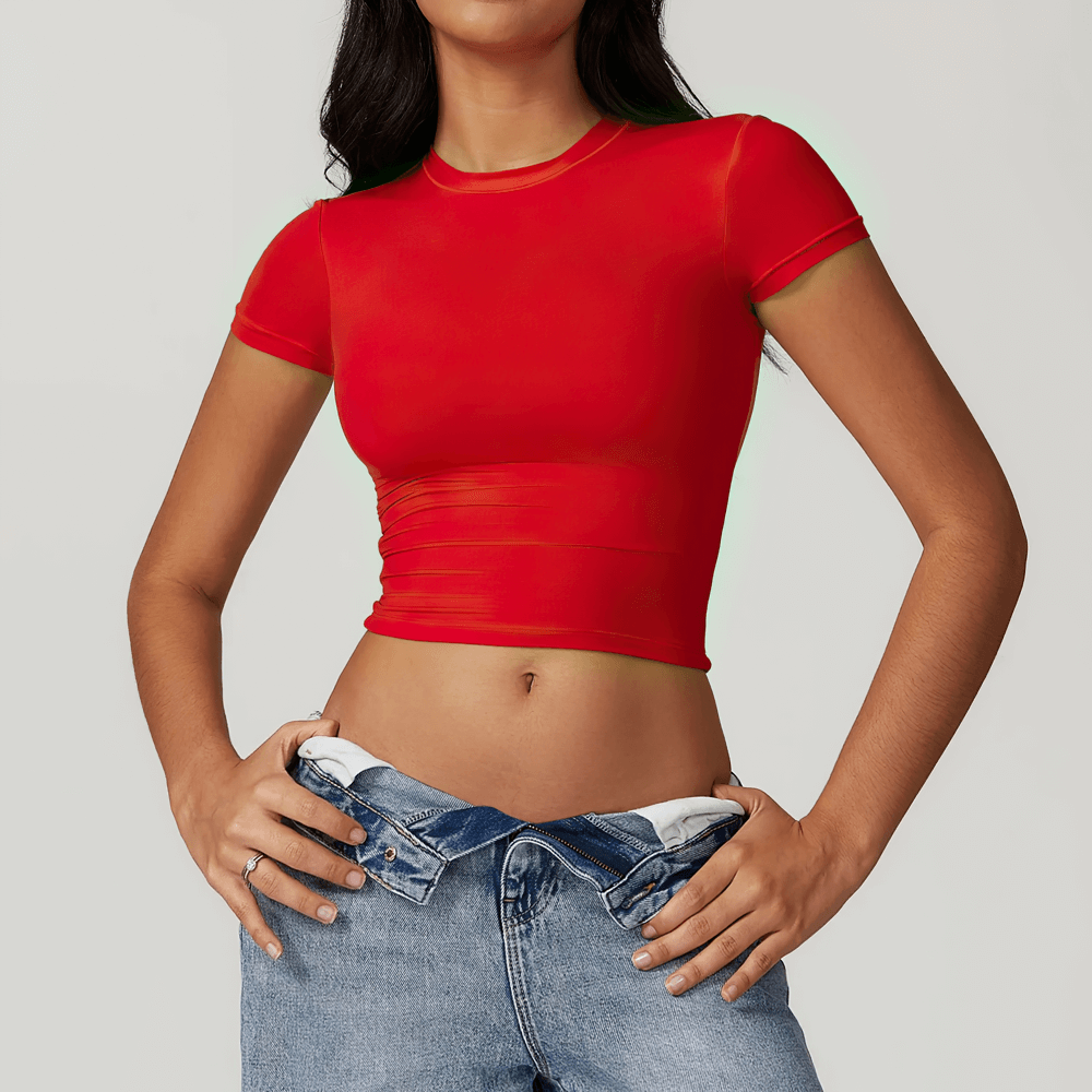 Woman wearing red crop elastic short sleeve T-shirt with blue jeans; perfect for fitness, yoga, and running. SF2427 quick-dry style.