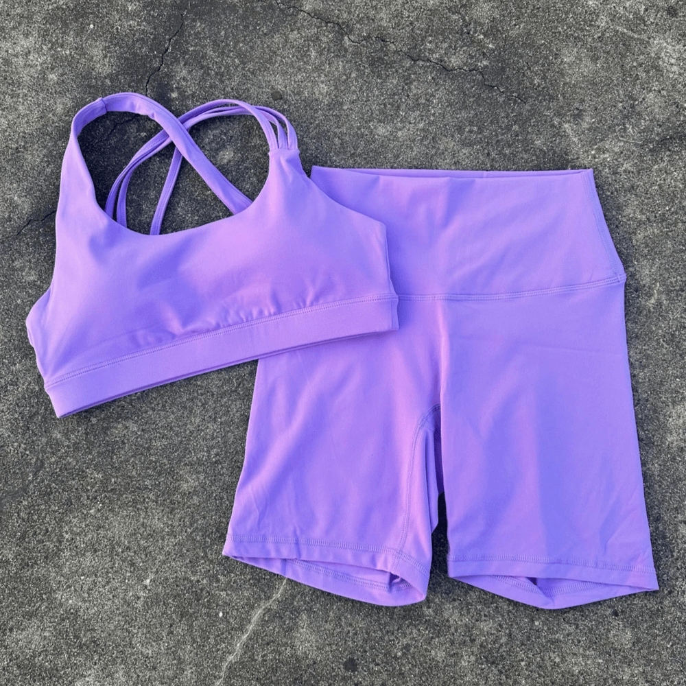 Alt Tag: Cross Back Yoga Bra and High Waist Gym Shorts Set - SF4355 purple cross back sports bra with high waist shorts laid flat