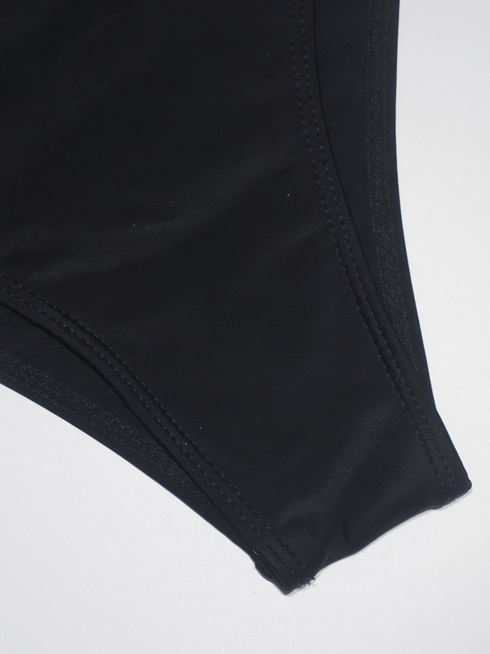 Close-up of the fabric detail of the Cross Strap One Piece Swimsuit with Gold Trim - SF4555 for women.