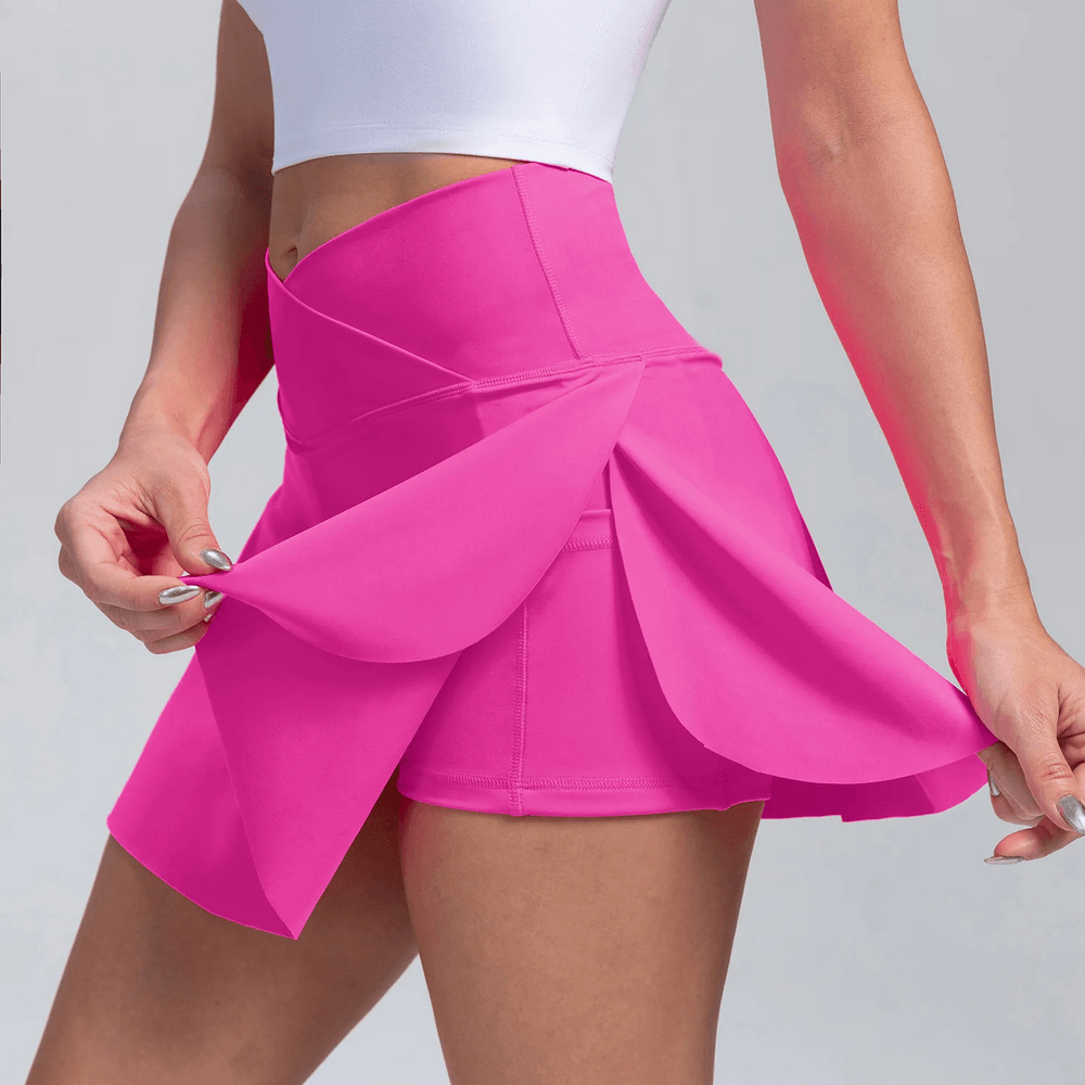 Alt Tag: Crossover High Waist Golf Skirt with Pocket - SF4439 pink pleated tennis skort with inner shorts and side pocket, stretchy crossover waist