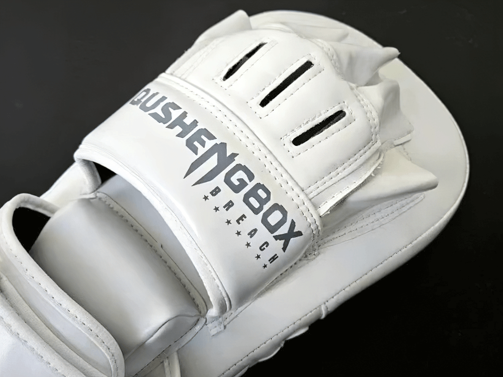 White PU leather boxing focus pad with hand-shaped design and reinforced stitching for training.