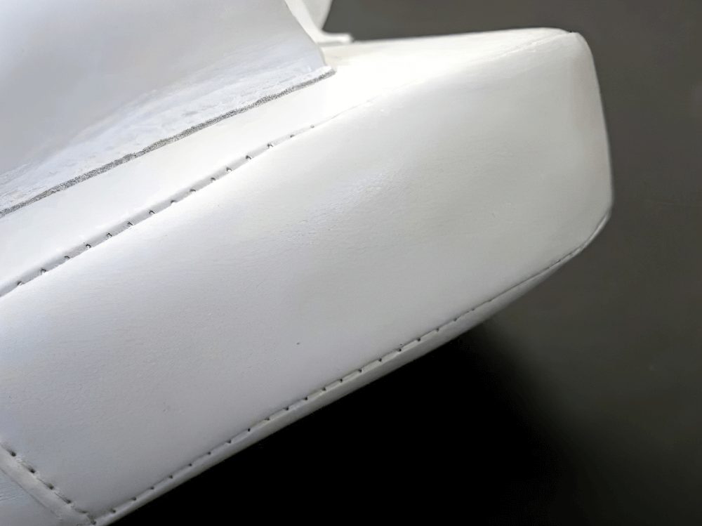 Close-up of curved PU leather focus pad with reinforced stitching for boxing training, model SF3149.