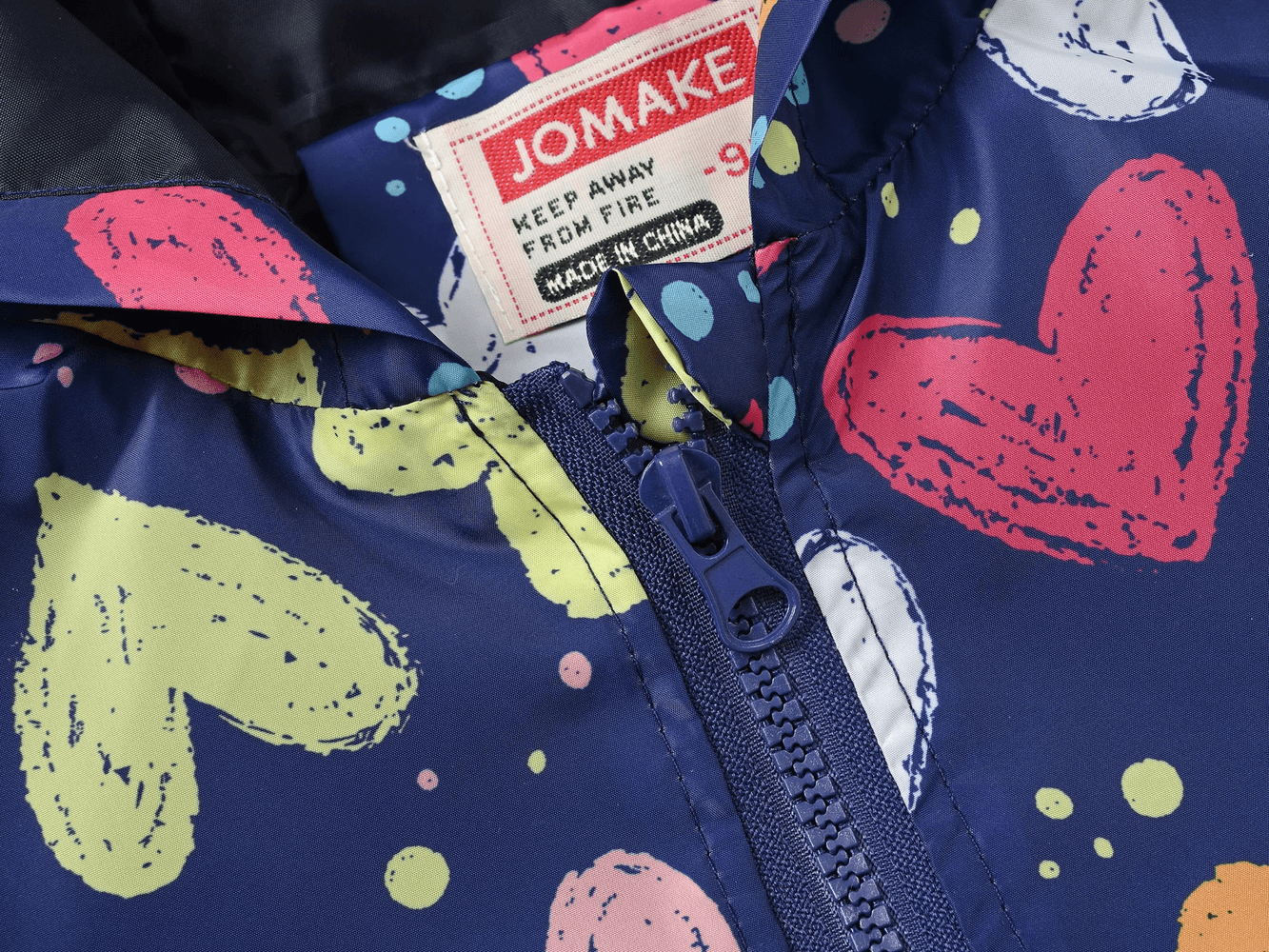 Close-up of Cute Printed Hooded Windbreaker Jacket - SF3594 showcasing colorful heart prints and zipper detail for kids' outdoor adventures.