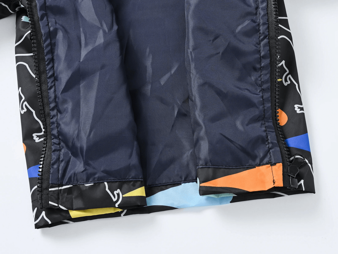 Inside view of Cute Printed Hooded Windbreaker Jacket - SF3594 showcasing colorful dinosaur and heart patterns on lightweight fabric.