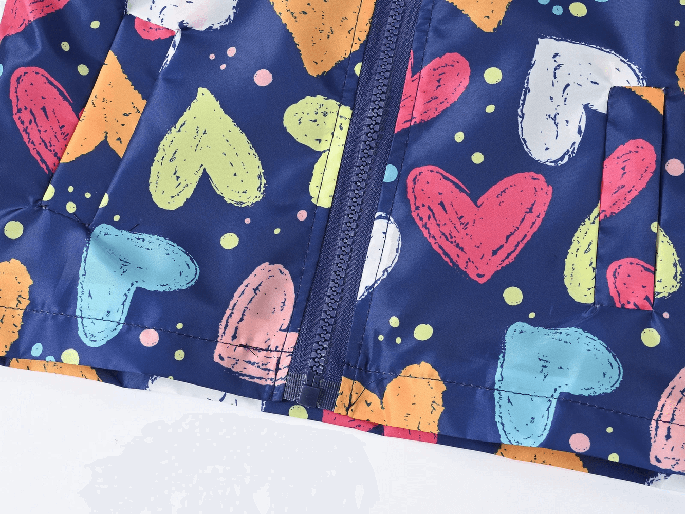 Close-up of Cute Printed Hooded Windbreaker Jacket - SF3594 with colorful heart and polka dot patterns, perfect for spring weather.