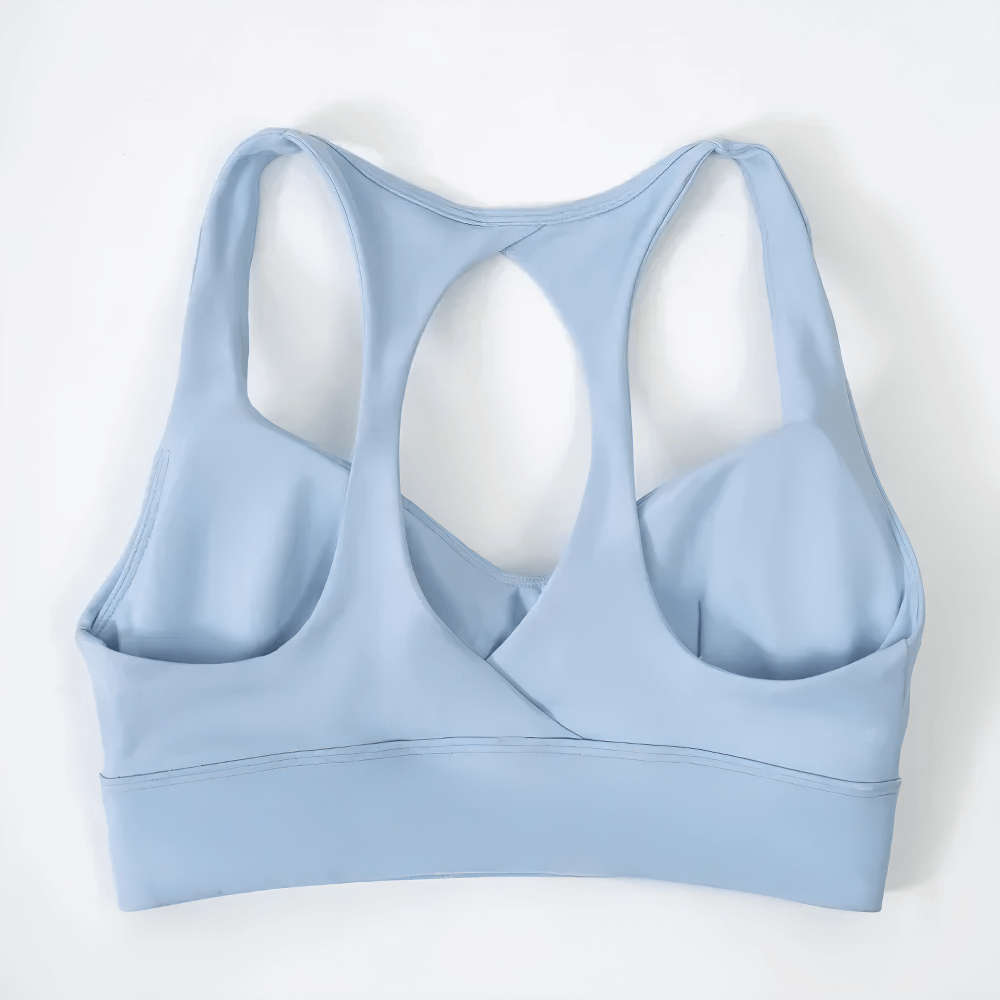 Sky blue Cutout Racerback Sports Bra With Removable Pads - SF4028 showing breathable and stylish crossback design for active women.