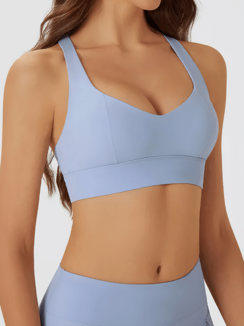 Cutout Racerback Sports Bra With Removable Pads - SF4028 modeled in light blue showing stylish crossback design and breathable fabric
