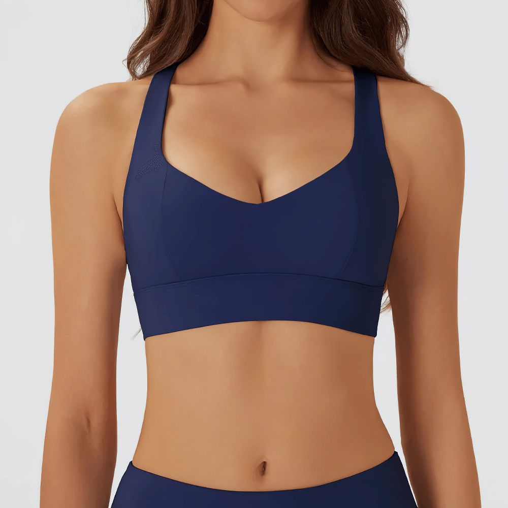 Woman wearing Cutout Racerback Sports Bra With Removable Pads - SF4028, navy blue, showcasing breathable crossback design